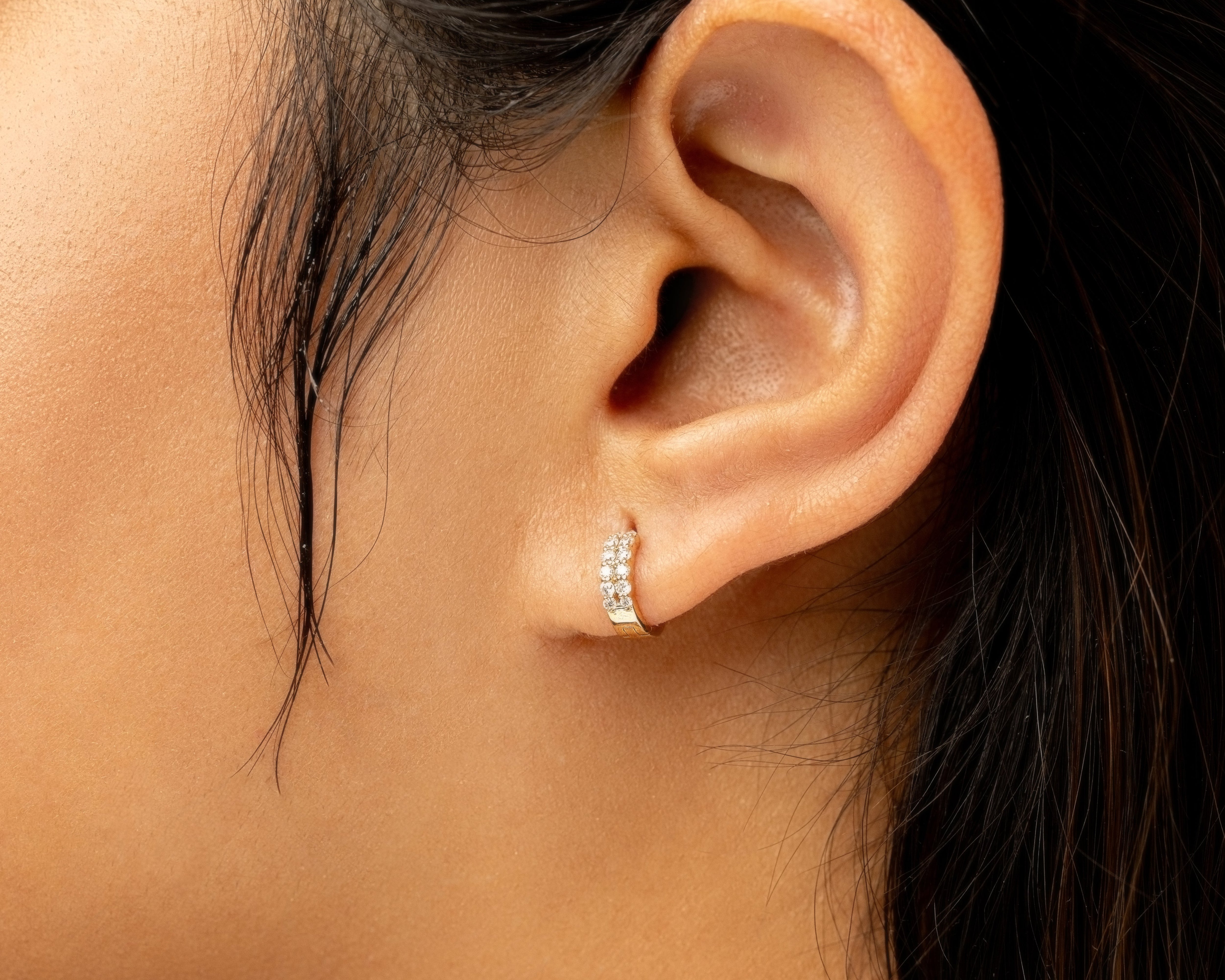 Close-up of an ear wearing a lab grown diamond cuff earring